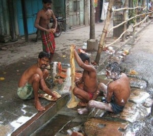 Indian men washing in the streets
